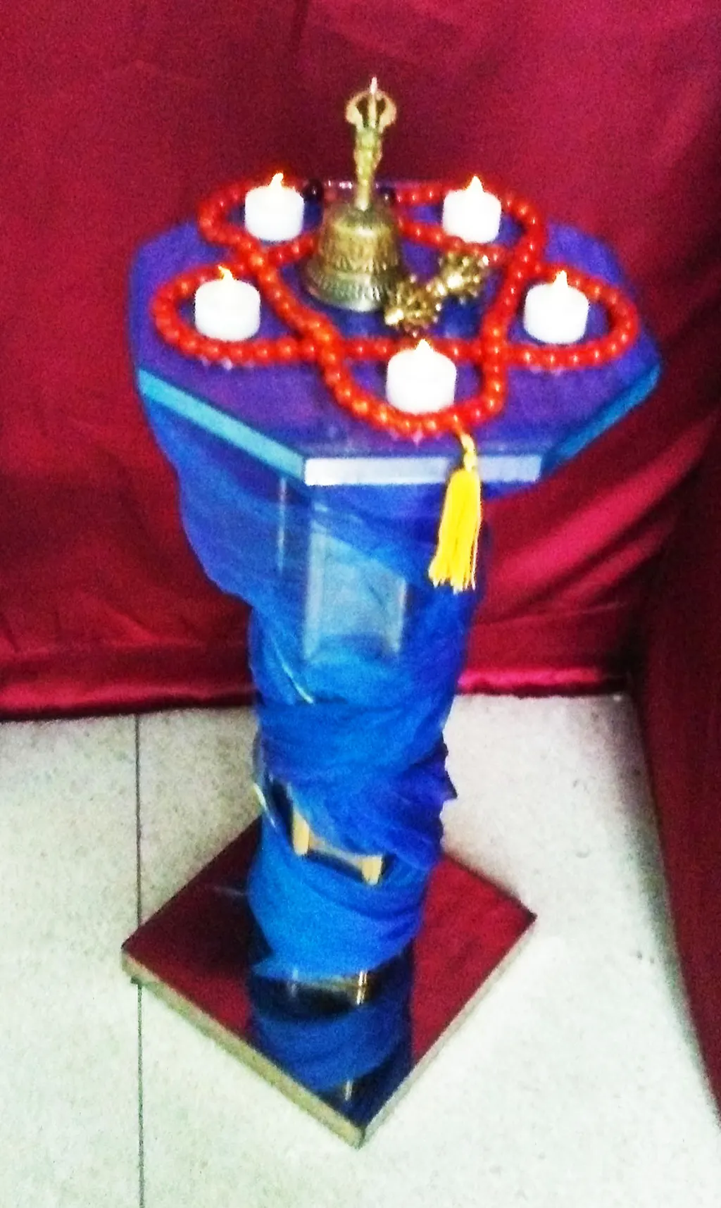 The ritual bell on a draped table